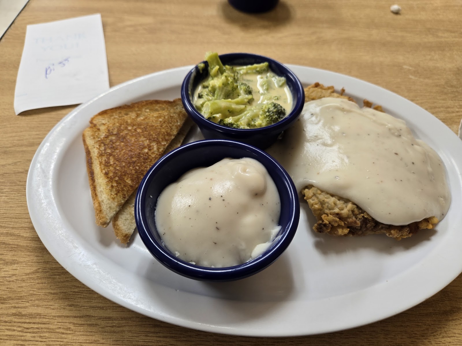 Chicken fried steak plate with broccoli and toast at Jack's Cafe